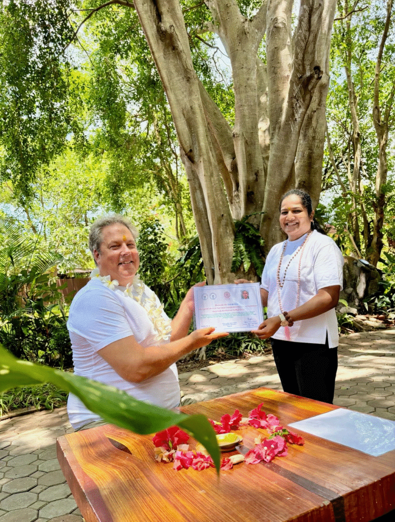 Yoga students celebrating their graduation and receiving course completion certificates