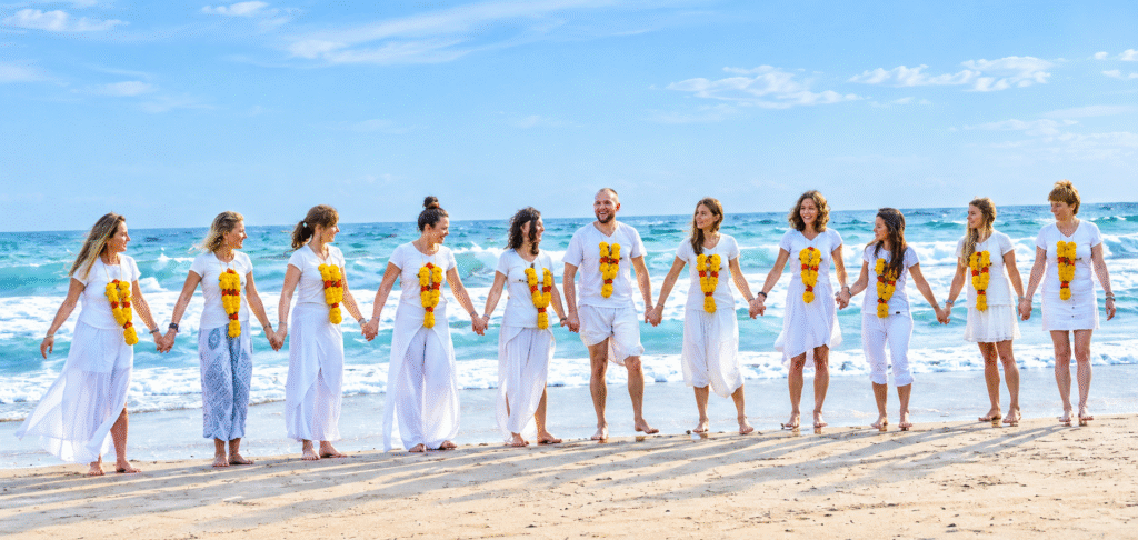 Morning yoga practice by the beach during yoga teacher training in Thailand