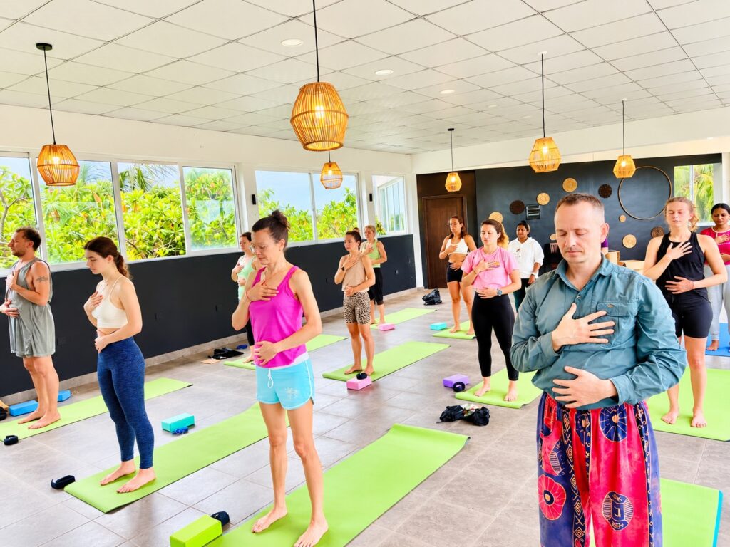 Student teaching a yoga class during the 200 hour practicum in Sri Lanka